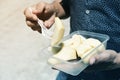 Young man eating a fruit salad outdoors Royalty Free Stock Photo