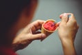 Young man eating ice cream on the street Royalty Free Stock Photo