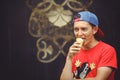 Young man eating ice cream on the street Royalty Free Stock Photo