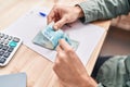 Young man ecommerce business worker counting brazil real banknotes at office