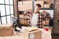 Young man ecommerce business worker tired working at office