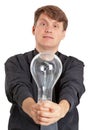 Young man with electric bulb in hands Royalty Free Stock Photo