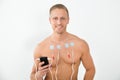 Young man with electrodes on chest Royalty Free Stock Photo