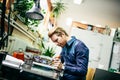 Young man in electronics workshop Royalty Free Stock Photo