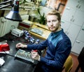 Young man in electronics workshop Royalty Free Stock Photo