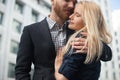 A young man embraces a girl in the city. Royalty Free Stock Photo