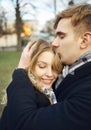 Young man embracing and tenderly kissing his girlfriend, feeling comfortable together. Royalty Free Stock Photo