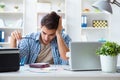 The young man employee working at copying machine in the office Royalty Free Stock Photo