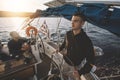 Young man at the helm Royalty Free Stock Photo