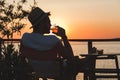 Young man enjoying at a beach bar Royalty Free Stock Photo