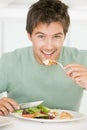 Young Man Enjoying A Healthy Meal Royalty Free Stock Photo