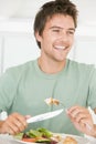 Young Man Enjoying A Healthy Meal Royalty Free Stock Photo