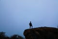 A young man is enjoying natural sky of the hill in the sky in the sky.