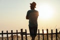 Young man enjoying sunset by the sea