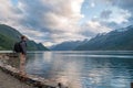 Young man enjoying the view of fjord, Norway Royalty Free Stock Photo