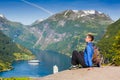 Young man enjoying the view near Geiranger fjord, Norway Royalty Free Stock Photo