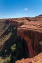 young man enyoing view of the Kings Canyon and standing on the edge of a cliff, Watarrka National Park, Northern Territory, Royalty Free Stock Photo