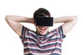 Young man is excited and happy. He is wearing 3D virtual reality headset. Royalty Free Stock Photo