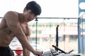 young man execute exercise in fitness center. male athlete choose dumbbell in gym. sporty guy working out in health club. Royalty Free Stock Photo