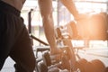 young man execute exercise in fitness center. male athlete choose dumbbell in gym. sporty guy working out in health club. Royalty Free Stock Photo