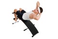 Young man exercise on bench working on abdominal m