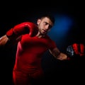 Young man exercising boxing in the gym