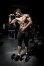 Young man exercising in dark and old gym Royalty Free Stock Photo