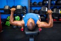 Young man exercising with dumbbells Royalty Free Stock Photo