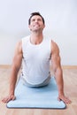 Young Man Exercising On Exercise Mat