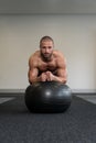 Young Man Exercising With Fitness Ball Abs Exercise Royalty Free Stock Photo