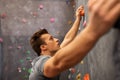 Young man exercising at indoor climbing gym Royalty Free Stock Photo