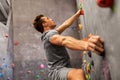 Young man exercising at indoor climbing gym Royalty Free Stock Photo