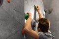 Young man exercising at indoor climbing gym Royalty Free Stock Photo