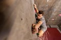 Young man exercising at indoor climbing gym Royalty Free Stock Photo