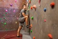 Young man exercising at indoor climbing gym Royalty Free Stock Photo