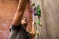 Young man exercising at indoor climbing gym Royalty Free Stock Photo