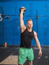Young man exercising with kettlebells in gym Royalty Free Stock Photo