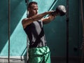 Young man exercising with kettlebells in gym Royalty Free Stock Photo