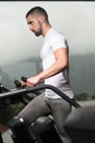 Young Man Exercising On A Stepper