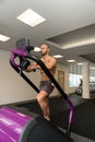 Young Man Exercising On A Stepper