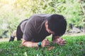 Young man exercising workout fitness doing planking outside on g Royalty Free Stock Photo