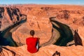 Man exploring horseshoe bend by the river Colorado