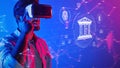 Young man exploring virtual reality with headset against a digital background showcasing technology, data, and Royalty Free Stock Photo