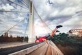 Young man extreme exercising on the bridge. Royalty Free Stock Photo