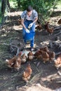 Young man farmer giving supplying stuff