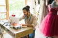 Male seamstress making a dress