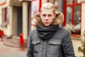 Young man in a fashionable winter jacket with a stylish scarf Royalty Free Stock Photo