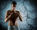 Young man in fighting or boxing position Royalty Free Stock Photo