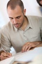 Young man filling administrative forms Royalty Free Stock Photo