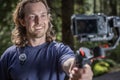 Young man filming with a camera gimbal Royalty Free Stock Photo
